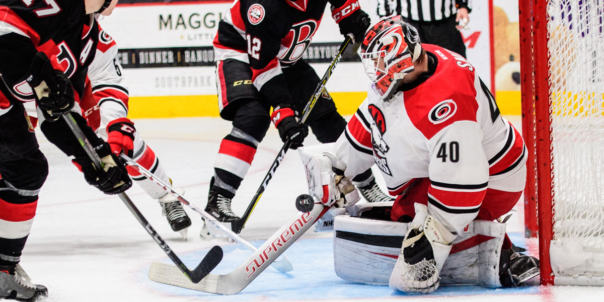Charlotte Checkers goalie Jeremy Smith makes a save in his team's 5-2 loss to the Belleville Senators
