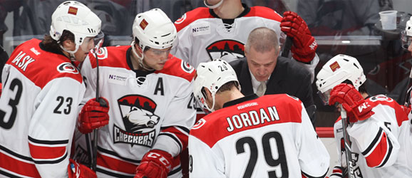 Coach Jeff Daniels on the Charlotte Checkers bench